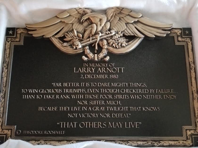 The memorial plaque for Larry Arnott of Islip. Arnott graduated from Islip High School in 1968 and served in all four branches of the military.